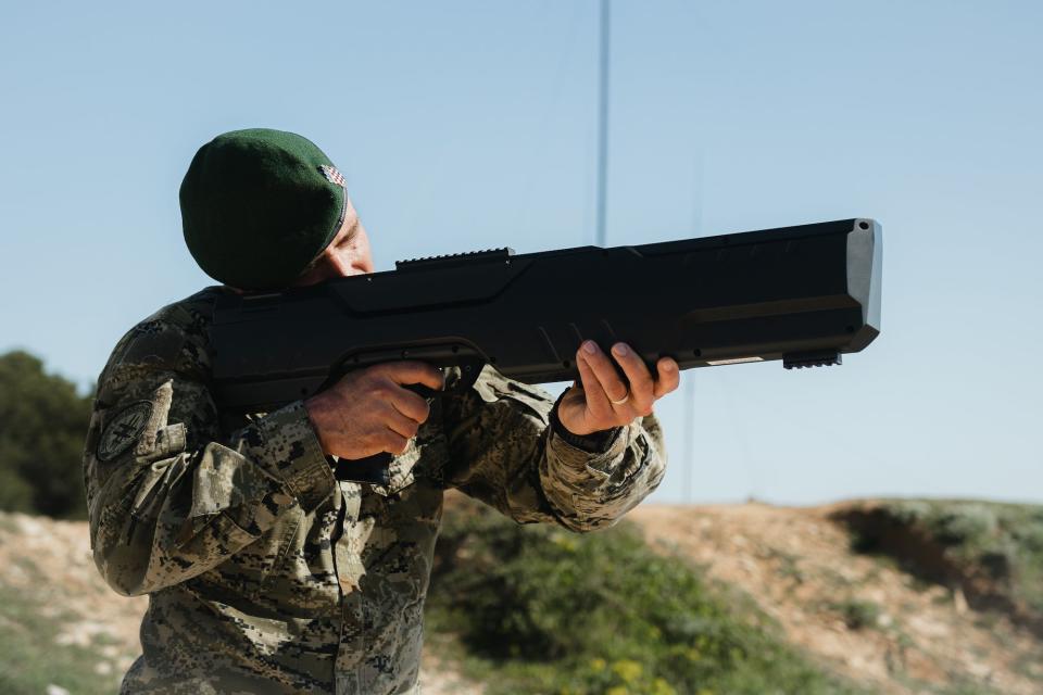 A Croatian soldier uses a QR-07S3 drone jammer system, a different kind of drone jammer also shaped like a gun.