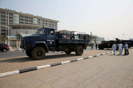 Anti-riot police vehicles are seen parked during an anti-South African violence rally in front of the Foreign Affairs Ministry building in Abuja, Nigeria February 23, 2017. REUTERS/Afolabi Sotunde