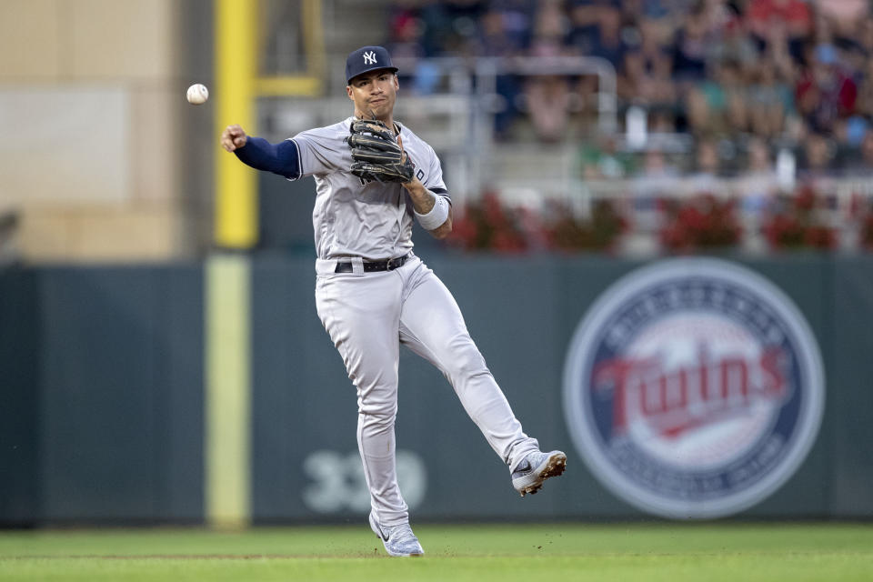 Jul 22, 2019; Minneapolis, MN, USA; New York Yankees shortstop Gleyber Torres (25) throws the ball to first base for an out in the fourth inning against the Minnesota Twins at Target Field. Mandatory Credit: Jesse Johnson-USA TODAY Sports