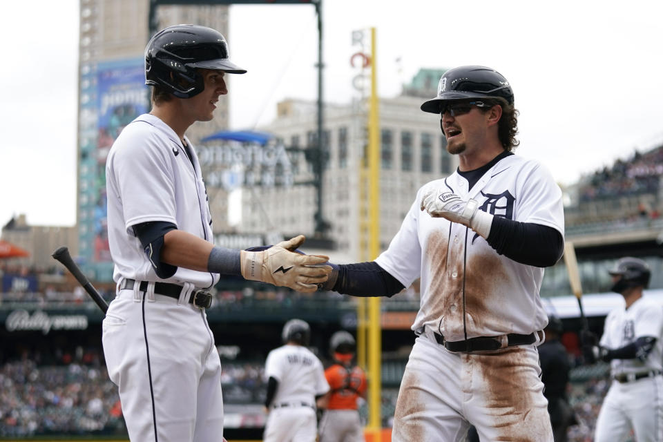 Detroit Tigers' Zach McKinstry, right, celebrate scoring with Nick Maton, left, against the Baltimore Orioles in the first inning during the first baseball game of a doubleheader, Saturday, April 29, 2023, in Detroit.