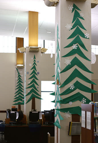 Turn pillars or columns into a forest using construction paper.