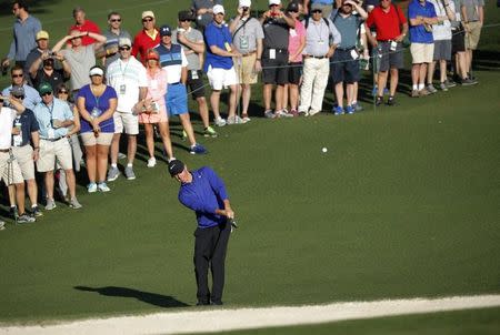 Rory McIlroy of Northern Ireland chips onto the second green during Tuesday practice rounds for the 2017 Masters at Augusta National Golf Course in Augusta, Georgia, U.S., April 4, 2017. REUTERS/Mike Segar