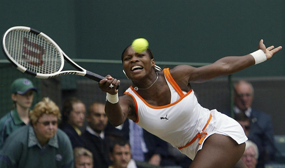 FILE - Serena Williams plays a return to fellow American Jennifer Capriati during their women's singles quarter final match at the All England Lawn Tennis Championships on the Centre Court at Wimbledon, Tuesday July 1, 2003. Saying “the countdown has begun,” 23-time Grand Slam champion Serena Williams announced Tuesday, Aug. 9, 2022, she is ready to step away from tennis so she can turn her focus to having another child and her business interests, presaging the end of a career that transcended sports. (AP Photo/Anja Niedringhaus, File)