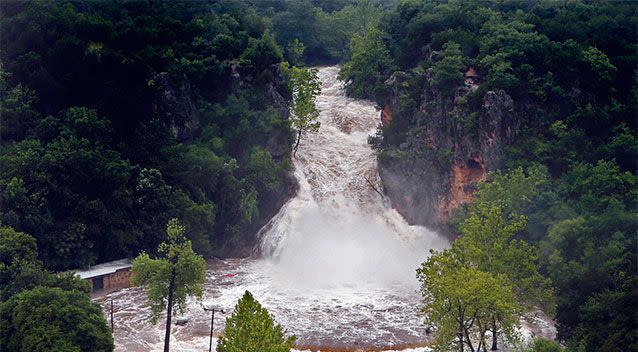 Water pours over Turner Falls and floods the park below in Davis, Oklahoma. Photo: AP