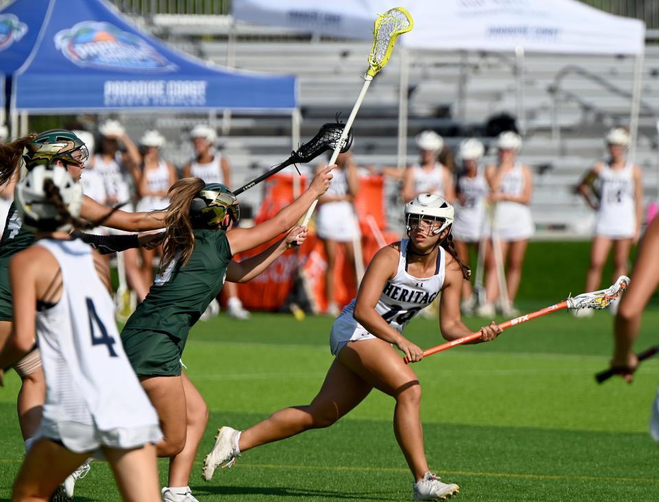 American Heritage-Delray's Chiara Scichilone (20) looks to make a pass during their game with St. Stephen’s Episcopal in a girls 1A lacrosse semifinal matchup in Naples on May 4.