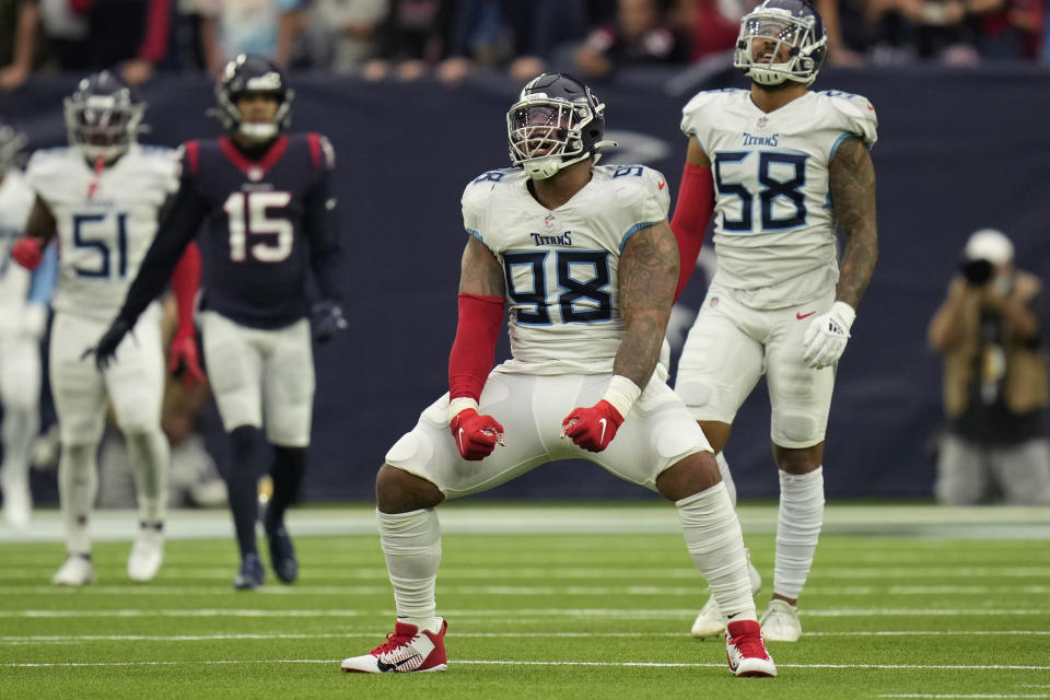 Tennessee Titans defensive end Jeffery Simmons (98) celebrates after sacking Houston Texans quarterback Davis Mills during the second half of an NFL football game, Sunday, Jan. 9, 2022, in Houston. (AP Photo/Eric Christian Smith)