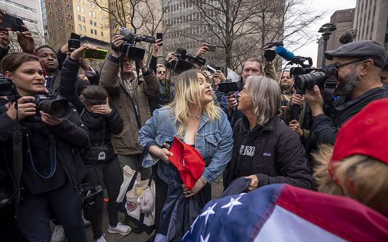 A Trump supporter and an anti-Trump protestor argue outside of New York Criminal Court