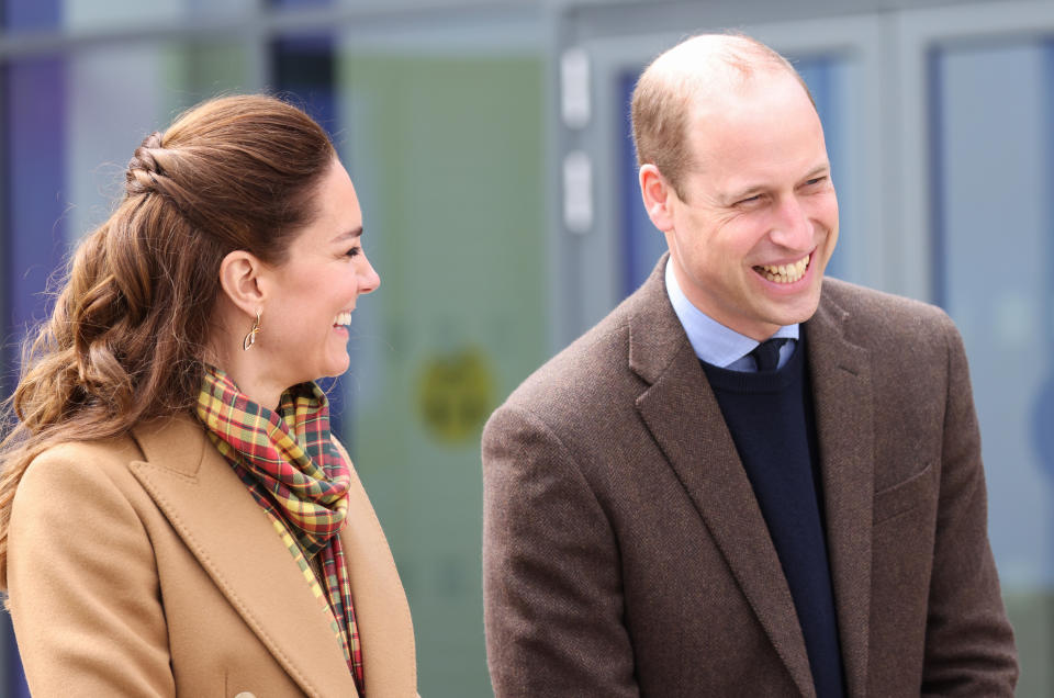 KIRKWALL, SCOTLAND - MAY 25: Prince William, Duke of Cambridge and Catherine, Duchess of Cambridge laugh as they officially open The Balfour, Orkney Hospital on day five of their week long visit to Scotland on May 25, 2021 in Kirkwall, Scotland. Recently opened in 2019, The Balfour replaced the old hospital, which had served the community for ninety years. The new facility has enabled the repatriation of many NHS services from the Scottish mainland, allowing Orkney’s population to receive most of their healthcare at home. The new building’s circular design is based on the 5000-year-old Neolithic settlement, Skara Brae, making it a unique reflection of the local landscape in which many historical sites are circles. (Photo by Chris Jackson - WPA Pool/Getty Images)