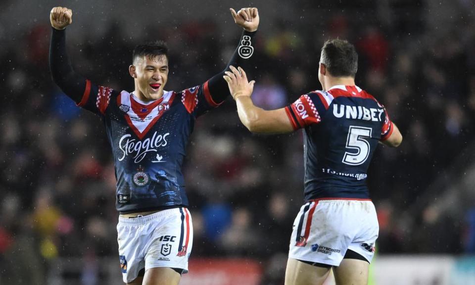 Joseph Manu and Brett Morriss celebrate victory for Sydney Roosters.