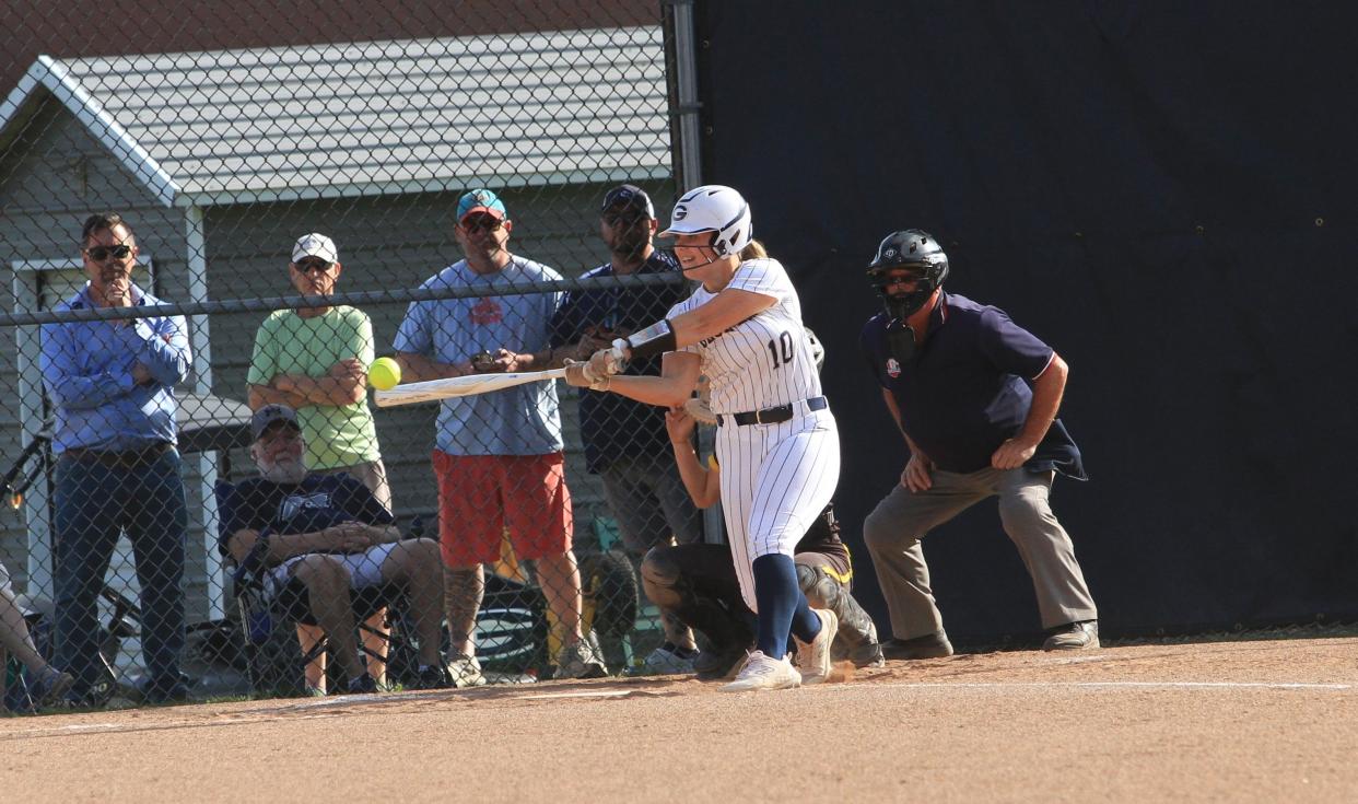 Granville's Sophia Patena hits a home run against Watkins Memorial on Monday.