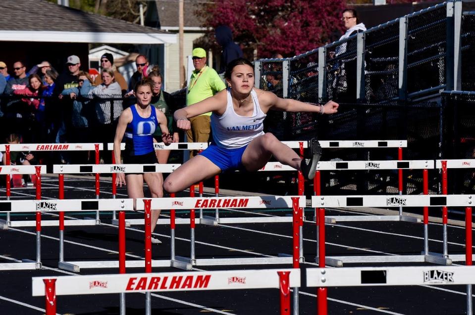 A Van Meter runner competes in the shuttle hurdle relay during the West Central Activities Conference meet on Tuesday, May 2, 2023, in Earlham.