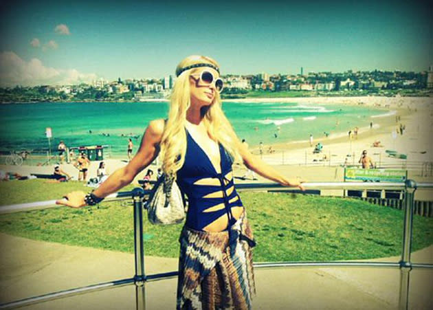 Celebrity photos: Paris Hilton has recently been voted the most annoying celebrity, and we can’t imagine that this smug image of her chilling at the beach in a swimming costume will help her cause that much.