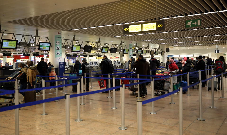 BRUSSELS, BELGIUM - DECEMBER 23: Passengers are seen at Brussels Airport as flights to UK begin again after Belgium temporarily banned air and rail links to UK for 48 hours due to the detection of mutant coronavirus (COVID-19), with 70 per cent increased transmissibility rate, in UK, on December 23, 2020 in Brussels, Belgium. (Photo by Dursun Aydemir/Anadolu Agency via Getty Images)