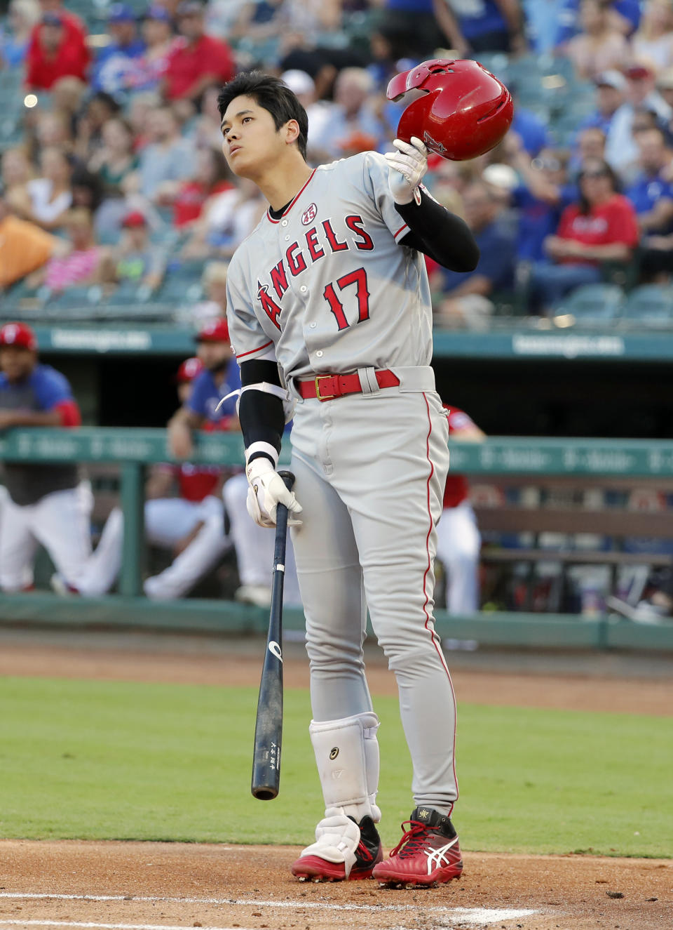 Los Angeles Angels' Shohei Ohtani watches the flight of his foul ball during an at-bat in the first inning of baseball game against the Texas Rangers in Arlington, Texas, Monday, Aug. 19, 2019. (AP Photo/Tony Gutierrez)