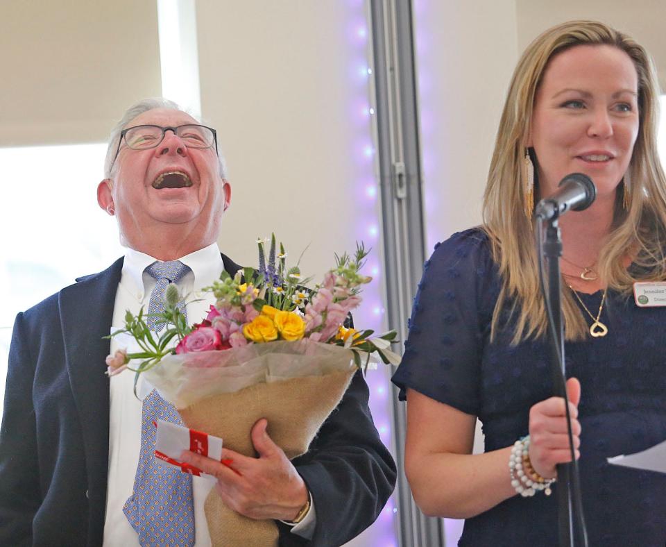 Volunteer Joseph Millburg, left, with Hingham Elder Services Director Jennifer Young at a celebration luncheon Tuesday, April 11, 2023.