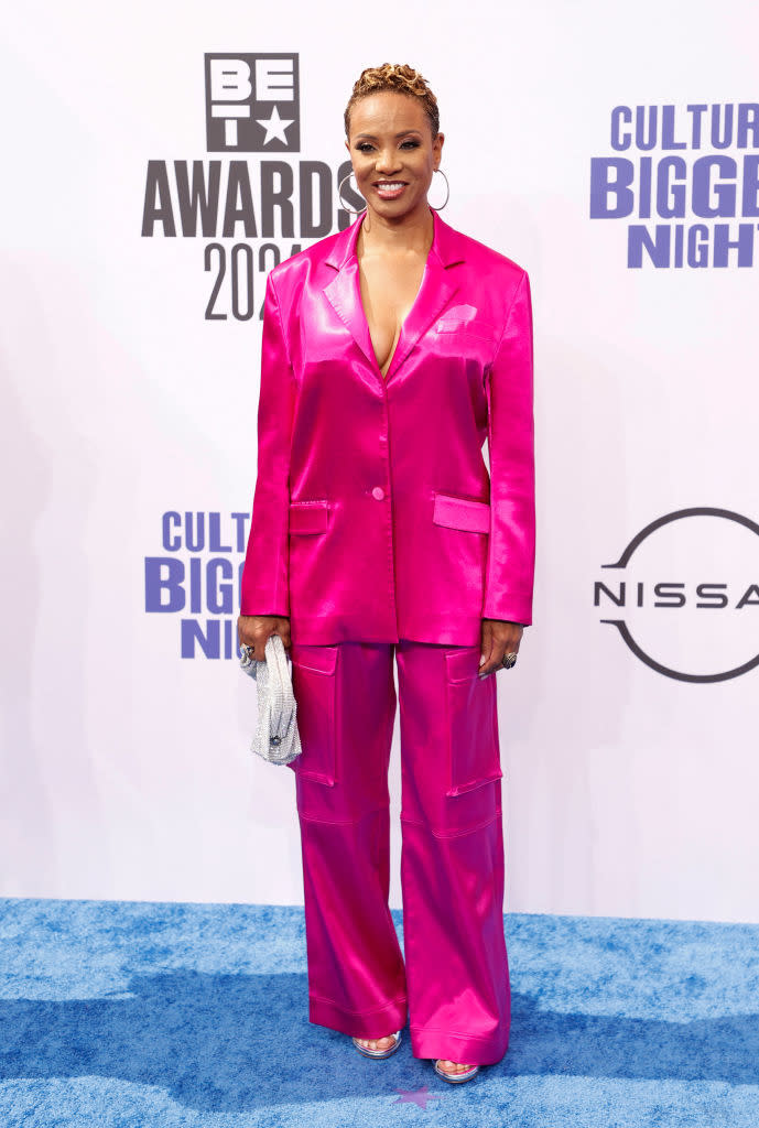 MC Lyte on the red carpet, wearing a stylish oversized shiny suit at the BET Awards 2023