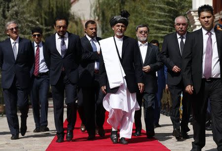 Afghanistan's new President Ashraf Ghani Ahmadzai (C) arrives for his inauguration as president in Kabul September 29, 2014. REUTERS/Omar Sobhani