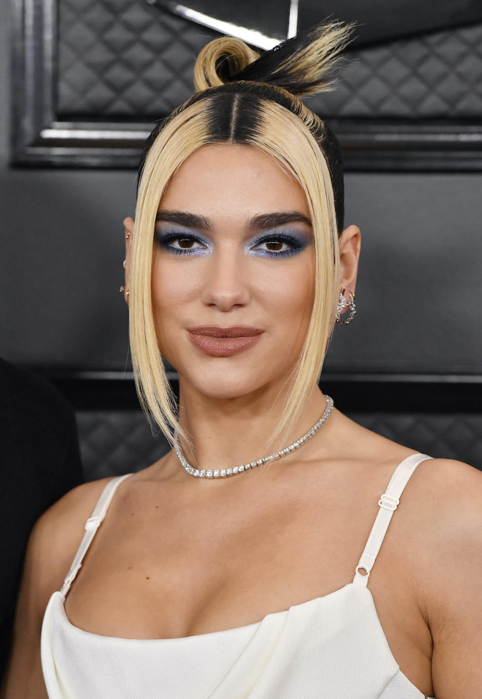 <p> If there's one make-up item that really characterises the '70s, it's blue eyeshadow - a staple look of the decade. Here, singer Dua Lipa lets the shade do the talking, keeping the rest of her make-up neutral. </p>