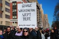 <p>A demonstrator holds up a sign during the “Not My President’s Day” rally at Central Park West in New York City on Feb. 20, 2017. (Gordon Donovan/Yahoo News) </p>