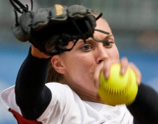 Canadian softball pitcher Lauren Bay-Regula, shown during her last Olympic game in 2008, discusses the pain and pleasure of returning to competition thirteen years and three children after she retired from the sport. (Paul Chiasson/The Canadian Press - image credit)