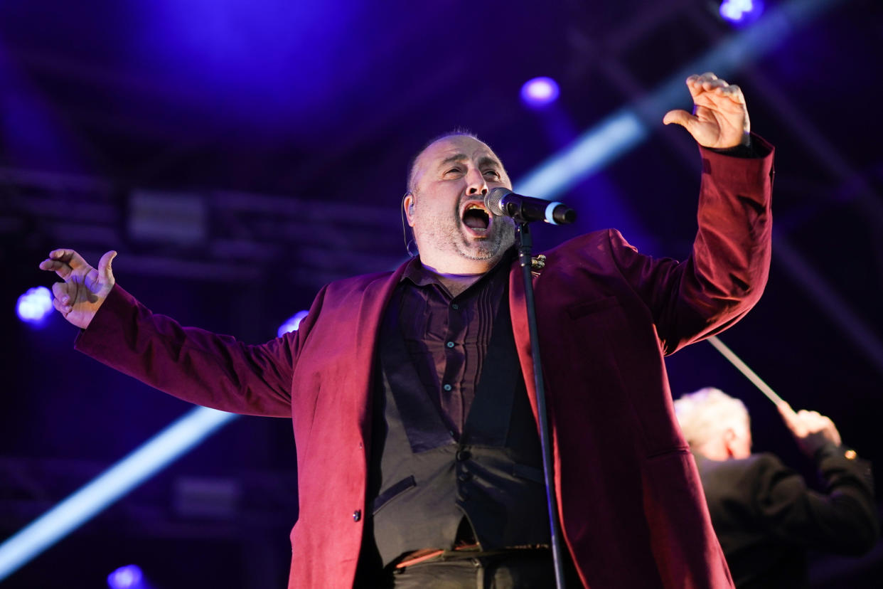 YORK, ENGLAND - AUGUST 21: Tenor Wynne Evans performs during the Castle Howard Proms event on August 21, 2021 in York, England. Held in the gardens of the famous stately home and forming part of the Castle Howard Live Music Weekend 2021, the outdoor picnic concert celebrates the best of British with a rousing medley of traditional orchestral anthems, popular classics and songs from musicals, played by the London Gala Orchestra. (Photo by Ian Forsyth/Getty Images)