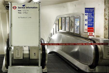 A service information board states "No Piccadilly Line" tube trains during strikes at Green Park underground station in London February 5, 2014. REUTERS/Luke MacGregor