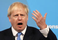 Boris Johnson gestures as he speaks after being announced as the new leader of the Conservative Party in London, Tuesday, July 23, 2019. Brexit champion Boris Johnson won the contest to lead Britain's governing Conservative Party on Tuesday, and will become the country's next prime minister. (AP Photo/Frank Augstein)