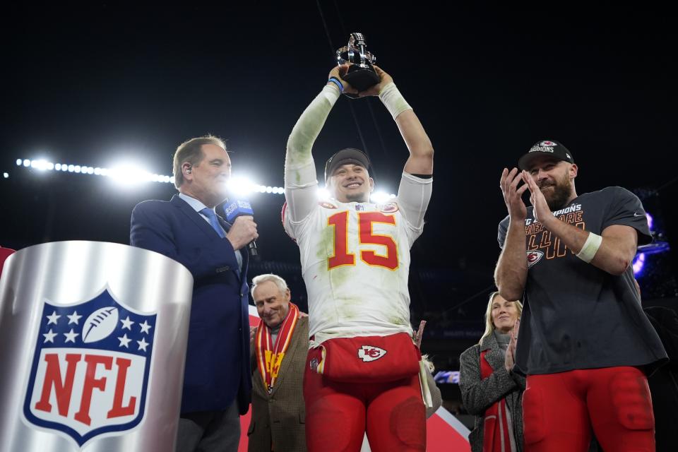 Kansas City Chiefs quarterback Patrick Mahomes (15) holds up the Lamar Hunt Trophy next to Kansas City Chiefs tight end Travis Kelce (87) after the AFC Championship NFL football game against the Baltimore Ravens, Sunday, Jan. 28, 2024, in Baltimore. The Chiefs won 17-10. (AP Photo/Matt Slocum)