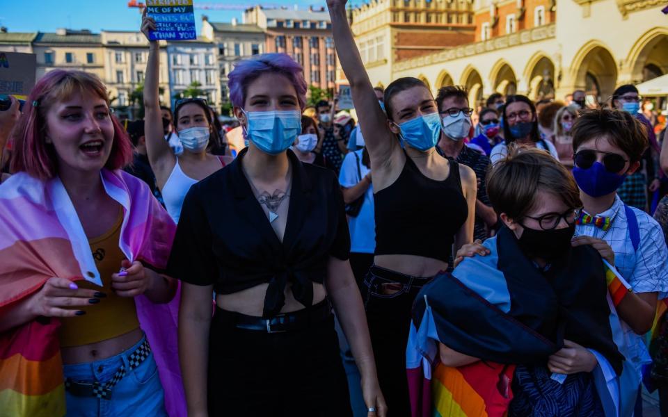 Protesters join a demo against discrimination against the LGBT community in Krakow, two days before the election - Getty