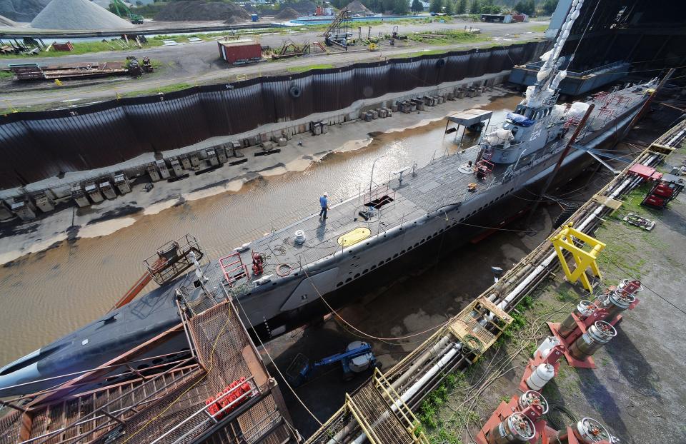 In this Aug. 11, 2021 file photo, repairs neared completion on the U.S.S. Cod submarine, which was docked at Donjon Shipbuilding & Repair in Erie. Donjon leases their waterfront property from the Erie-Western Pennsylvania Port Authority.