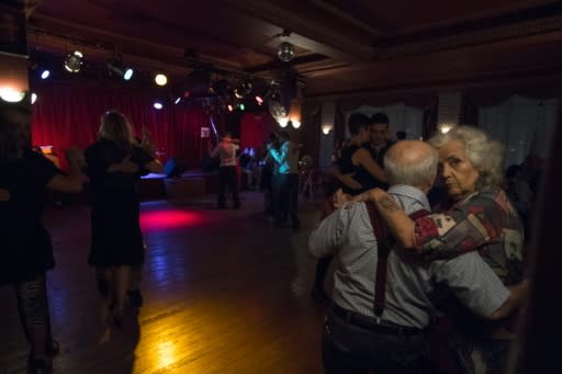 A couple dances tango at Chamuyo milonga in Montevideo