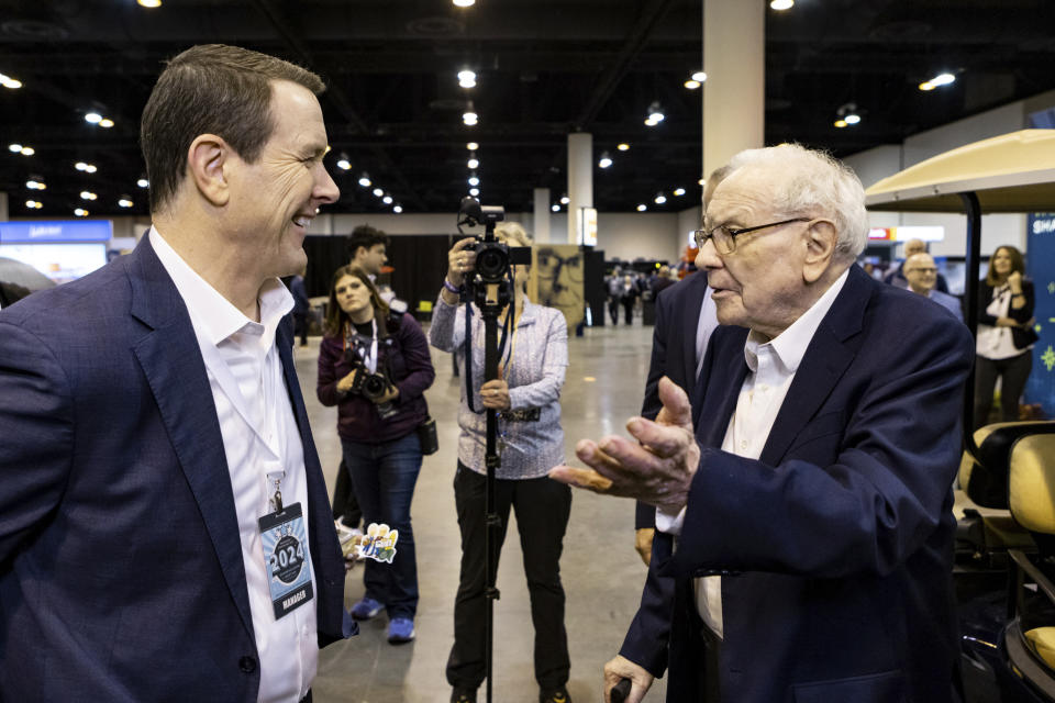 IMAGE DISTRIBUTED FOR SEE'S CANDIES - See's Candies Chairman and CEO Pat Egan speaks with Warren Buffett at the See's Candies booth during the Berkshire Hathaway shareholder meeting on Friday, May 3, 2024 in Omaha, Neb.  (John Peterson/AP Images for See's Candies)