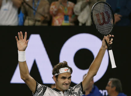 Tennis - Australian Open - Melbourne Park, Melbourne, Australia - 26/1/17 Switzerland's Roger Federer celebrates winning his Men's singles semi-final match against Switzerland's Stan Wawrinka. REUTERS/Issei Kato