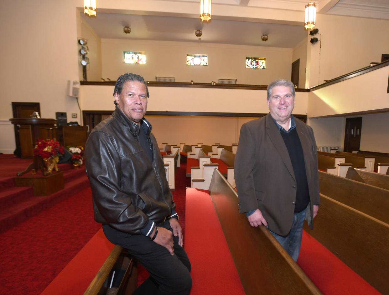 Rev. Richard Jordan of Antioch Baptist Church (left) and the Rev. Webb Parsons have become friends since Antioch bought the former Arlington Avenue Church of God building in Canton.