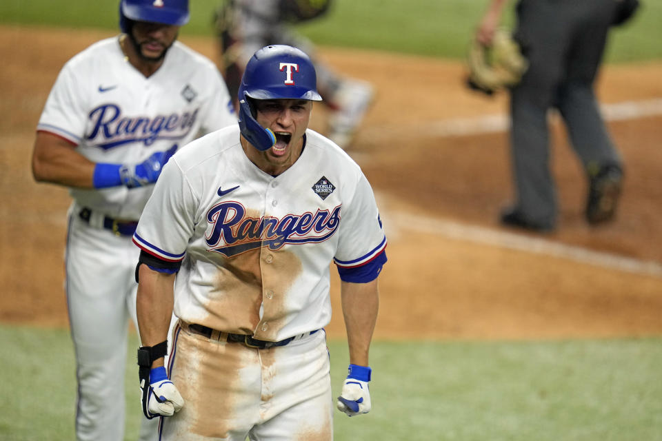 Texas Rangers' Corey Seager celebrates after hitting a two-run home run against the Arizona Diamondbacks during the ninth inning in Game 1 of the baseball World Series Friday, Oct. 27, 2023, in Arlington, Texas. (AP Photo/Julio Cortez)