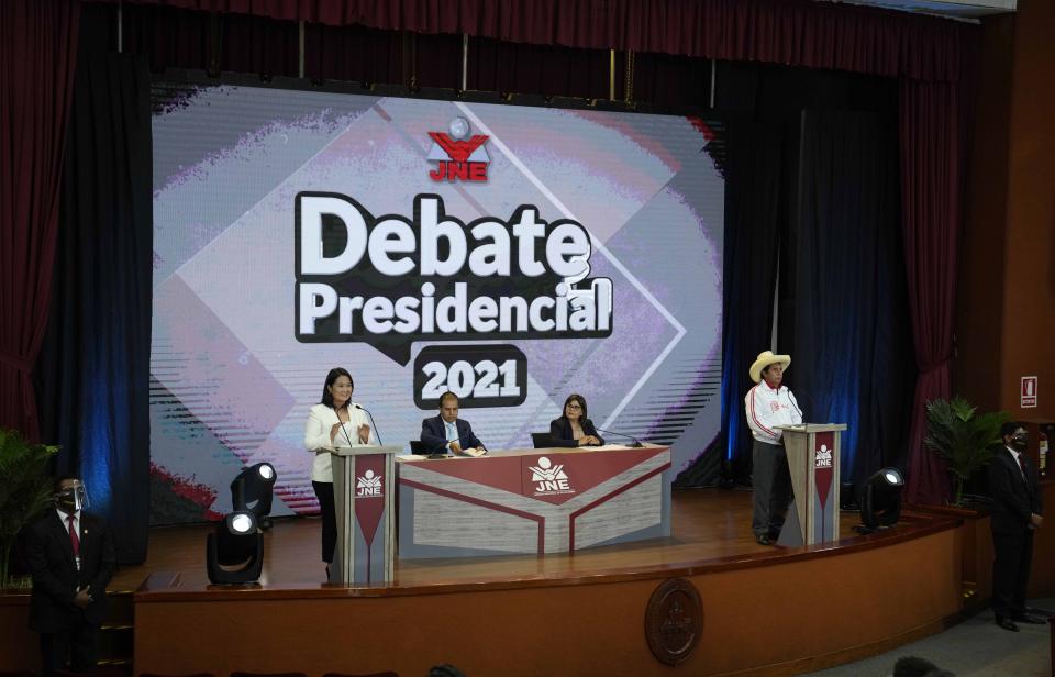 Keiko Fujimori of the Popular Force party, left, speaks during a presidential debate against Free Peru party presidential candidate Pedro Castillo, right, in Arequipa Peru, Sunday, May 30, 2021. Fujimori faces off against Castillo in the final presidential election debate before the June 6 elections. (AP Photo/Martin Mejia)