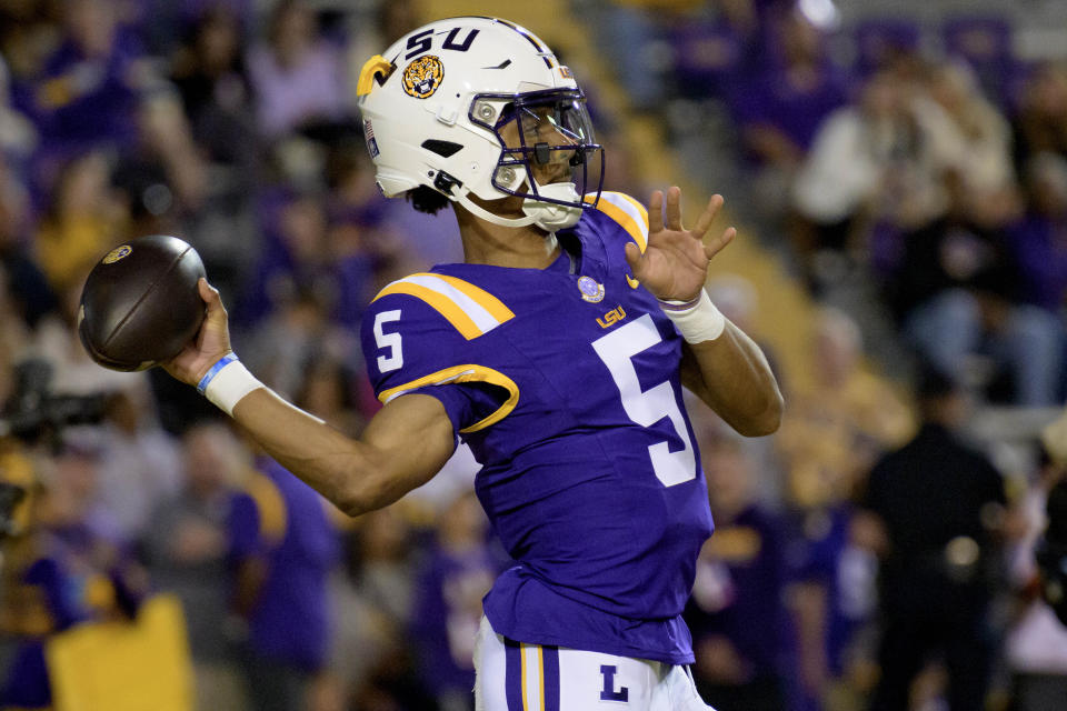 LSU quarterback Jayden Daniels (5) warms up before an NCAA college football game against Georgia State in Baton Rouge, La., Saturday, Nov. 18, 2023. (AP Photo/Matthew Hinton)