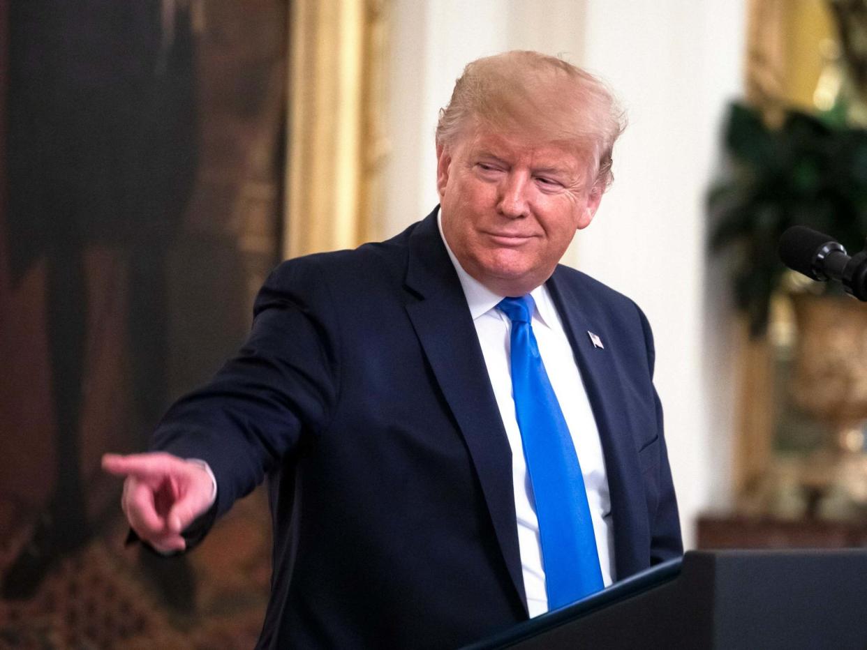 Donald Trump speaks before presenting the National Medal of Arts and the National Humanities Medal to eight recipients in the East Room of the White House in Washington, DC, on 21 November 2019: Jim Lo Scalzo/EPA