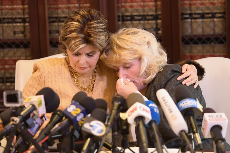 Attorney Gloria Allred, left, comforts her client Heather Kerr, who says disgraced Hollywood producer Harvey Weinstein unzipped his pants and forced himself on her when she was an aspiring actress in her 20s