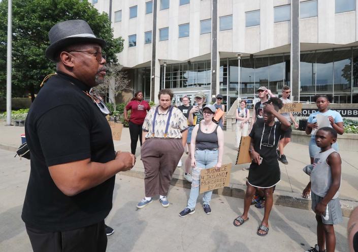 The Rev. Roderick C. Pounds Sr. of the Second Baptist Church speaks to protesters Friday in front of the Akron Police Department at the Harold K. Stubbs Justice Center.