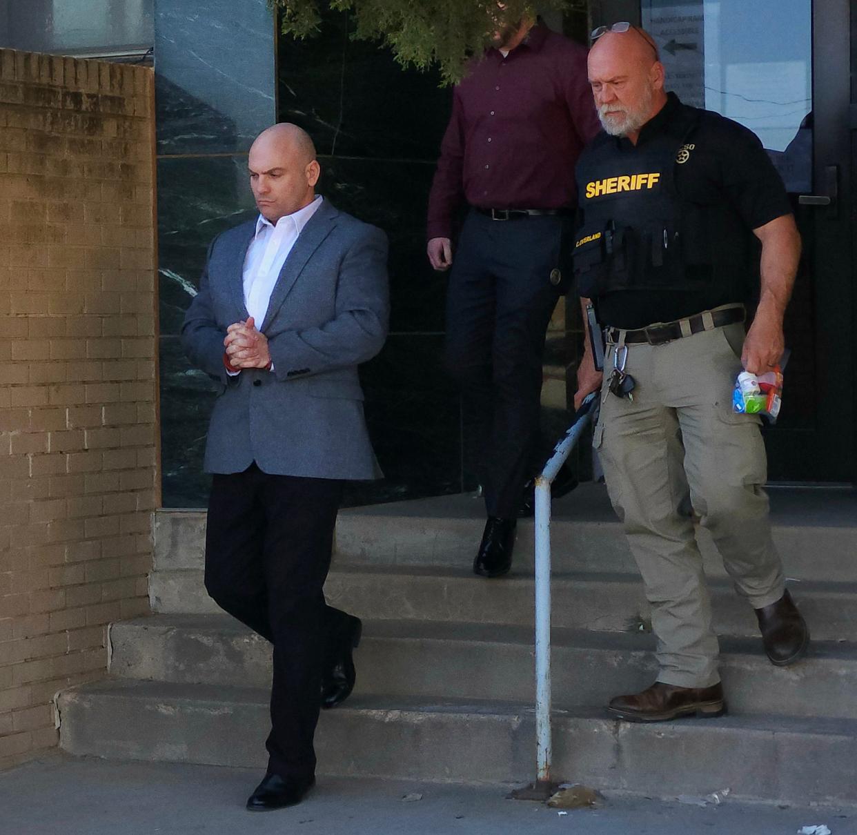 Jeremy Atchison is escorted out of the Lamb County Courthouse Wednesday after he was sentenced to life in prison without parole for the 2019 slaying of his mother, Jill Atchison, at her home in Levelland.