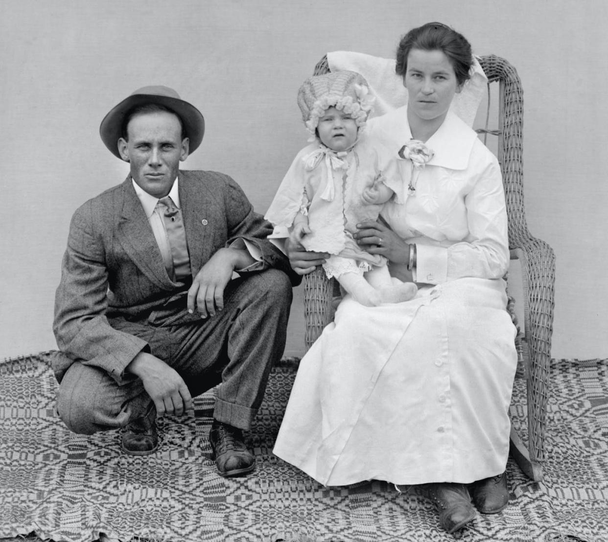 <span class="caption">At the turn of the 20th century, marriage was assumed to be an exercise in mutual misery.</span> <span class="attribution"><a class="link " href="https://www.gettyimages.com/detail/news-photo/mother-and-father-pose-with-their-baby-early-in-the-20th-news-photo/526305960?adppopup=true" rel="nofollow noopener" target="_blank" data-ylk="slk:Getty Images;elm:context_link;itc:0;sec:content-canvas">Getty Images</a></span>