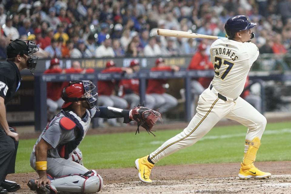 Milwaukee Brewers' Willy Adames hits a two-run scoring hit during the fifth inning of a baseball game against the St. Louis Cardinals Friday, May 10, 2024, in Milwaukee. (AP Photo/Morry Gash)