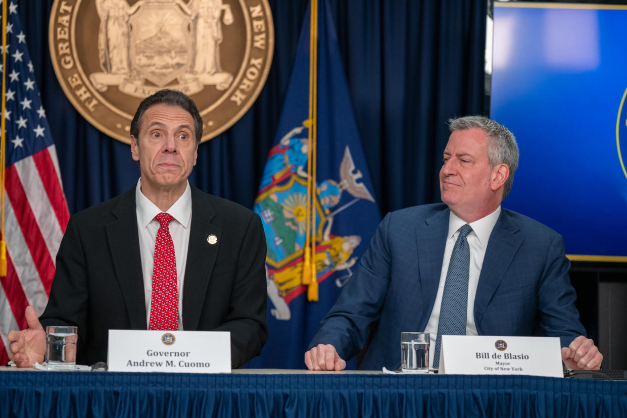 New York Gov. Andrew Cuomo and de Blasio at a news conference.