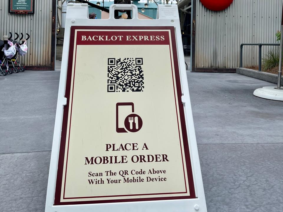 moble app qr code in front of backlot express dining at hollywood studios