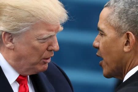 Barack Obama (R) greets Donald Trump at inauguration ceremonies swearing in Trump as president on the West front of the U.S. Capitol in Washington, U.S., January 20, 2017. REUTERS/Carlos Barria