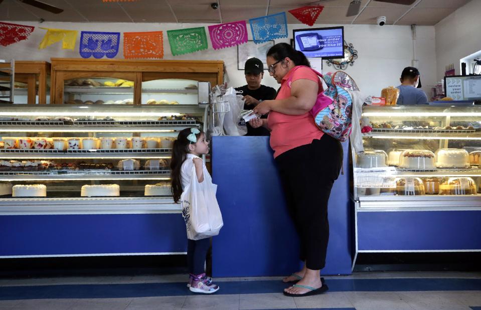 Vida Estrada shops at Bowie Bakery with her daughter Natalie Ulloa, 4, in the heart of the Segundo Barrio of El Paso,  Sept. 12, 2019.