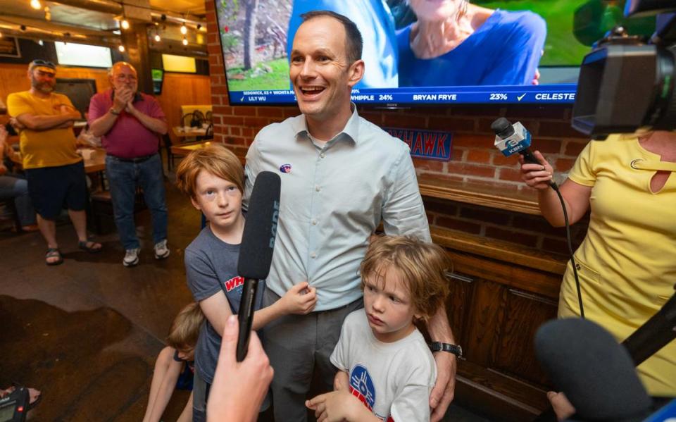 Wichita Mayor Brandon Whipple is surrounded by his children while he’s interviewed after unofficial final results showed him in second place in the Wichita mayoral race. The top two candidates advance to the general election in November. Former local TV reporter Lily Wu finished ahead of Whipple, who was about 400 votes ahead of City Council member Bryan Frye. Travis Heying/The Wichita Eagle