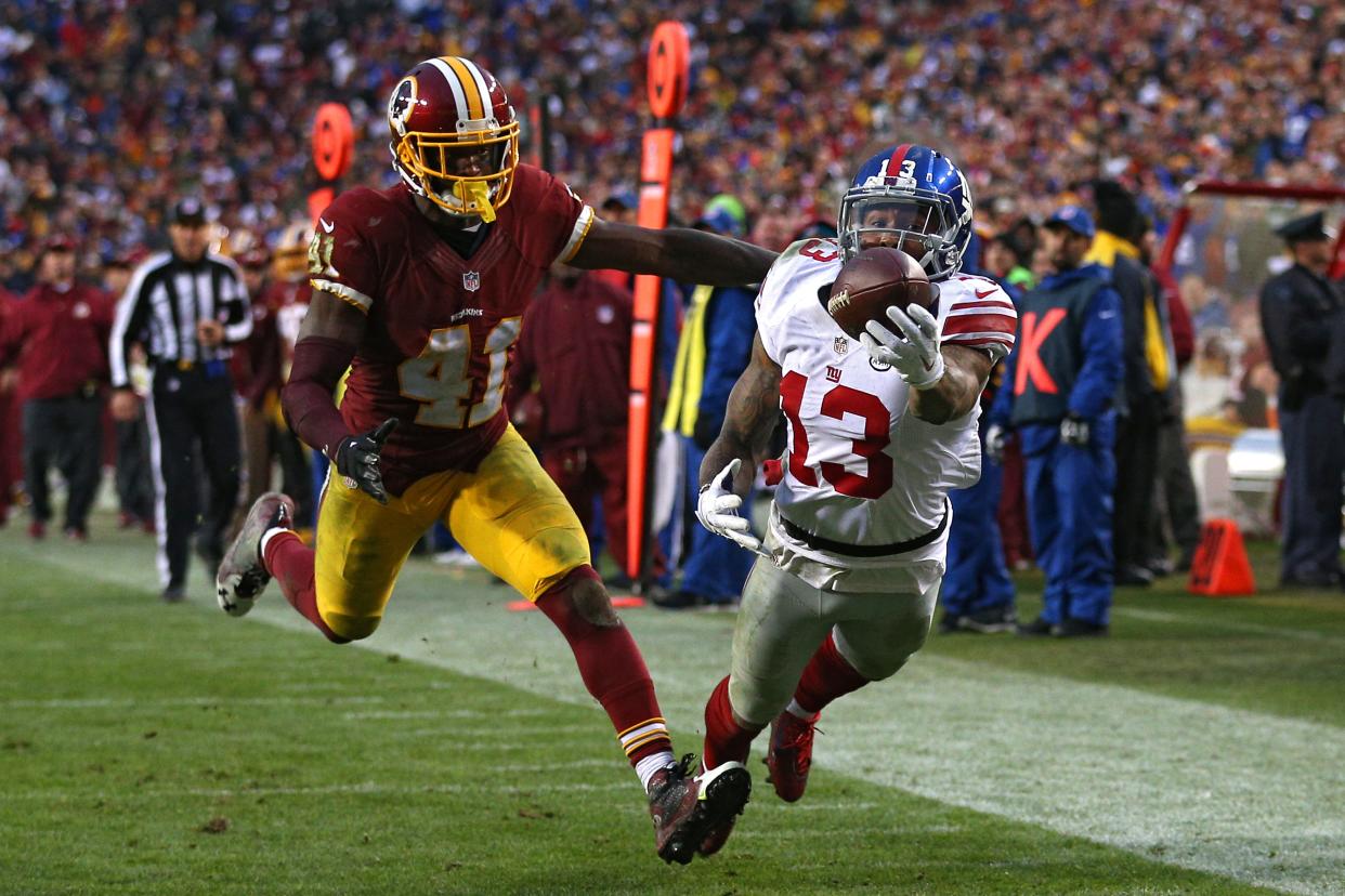 LANDOVER, MD - NOVEMBER 29: Wide receiver Odell Beckham #13 of the New York Giants scores a fourth quarter touchdown past cornerback Will Blackmon #41 of the Washington Redskins at FedExField on November 29, 2015 in Landover, Maryland. (Photo by Patrick Smith/Getty Images)