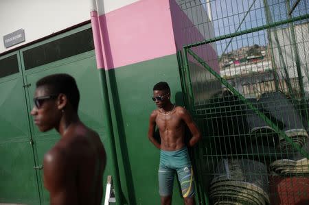 Anderson Guilherme (R), 16, attends a training session in Mangueira Olympic Village in Rio de Janeiro, Brazil, August 15, 2016. "Everything Bolt does I try and imitate to see if one day, if God wishes, I could be a third of what he is," Guilherme said. REUTERS/Ricardo Moraes